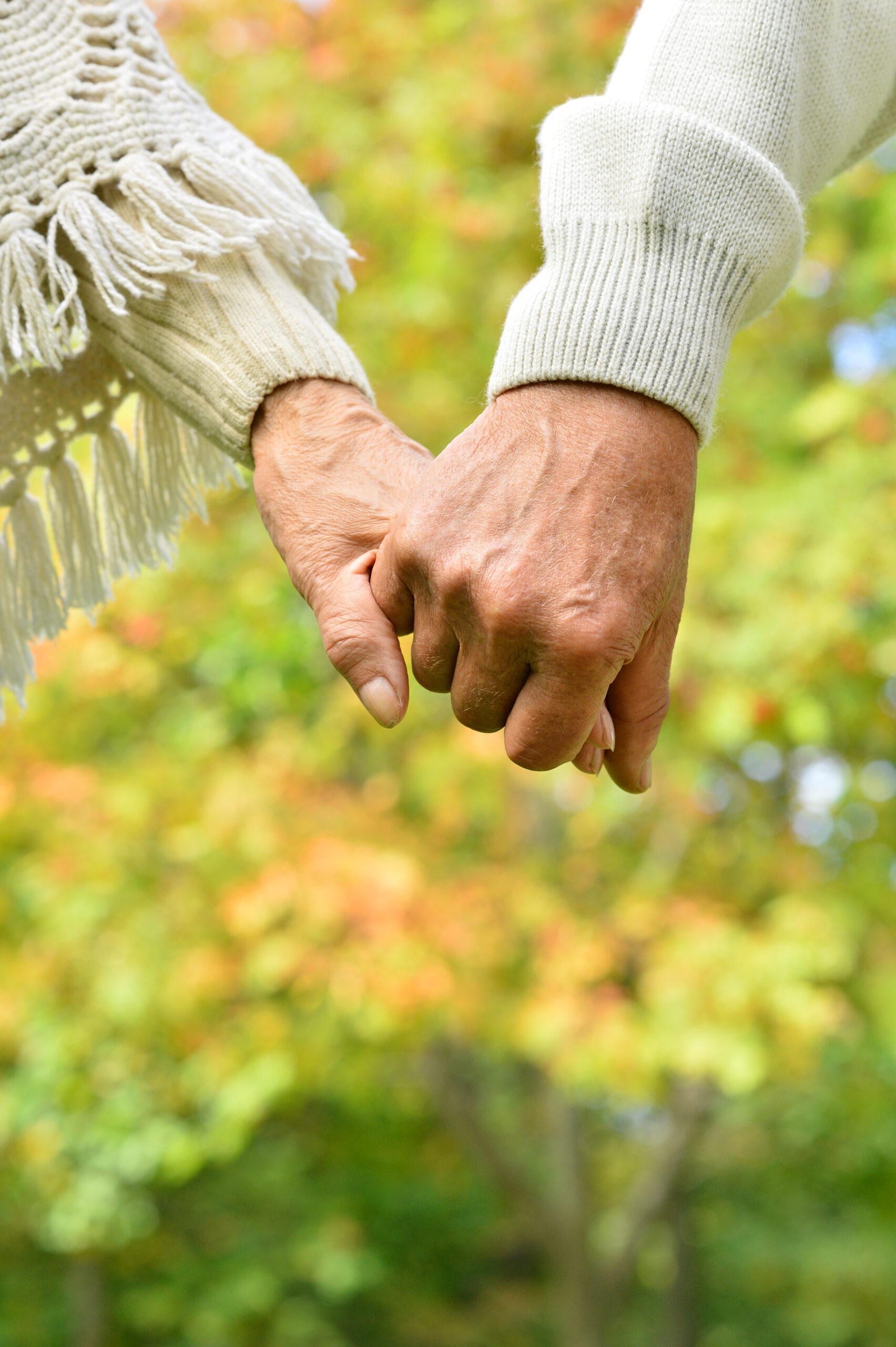 Elderly Couple Holding Hands